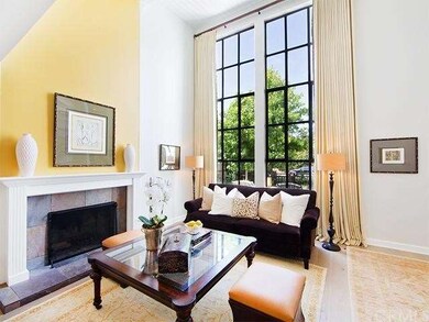 Custom draperies adorn the floor to ceiling window