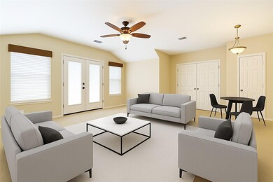 Living room with lofted ceiling, a ceiling fan, p