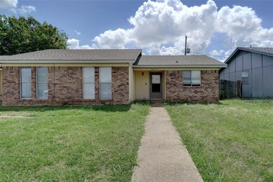 Ranch-style home with a front yard