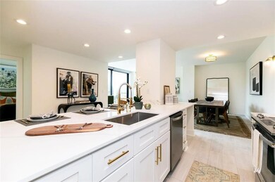 Kitchen with light tile patterned flooring, sink, 