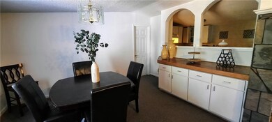 Entry of home showing dining room with open window