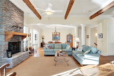 Gorgeous stone mantel and exposed beams