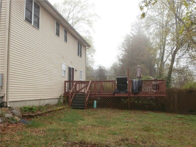 rear yard and oversized deck abutting fenced area