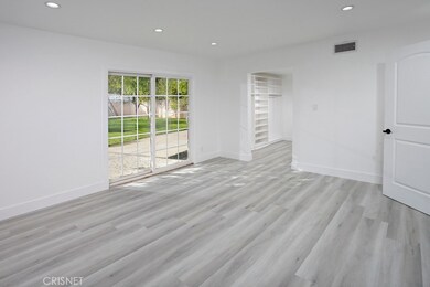 Master Suite - New barn door to walk-in closet, Walk-in closet with built-in organizers, Second closet with new mirrored wardrobe doors, Sliding doors to backyard, New light switches and outlets, New base moldings and New wood - grained luxury vinyl 