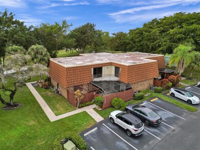 This townhome features ample screened in patios and balconies with plenty of guest parking (in yellow) and two assigned spots