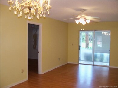 Living area with sliding doors to screened porch