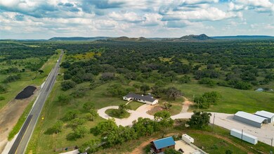Aerial view of property and surrounding area with