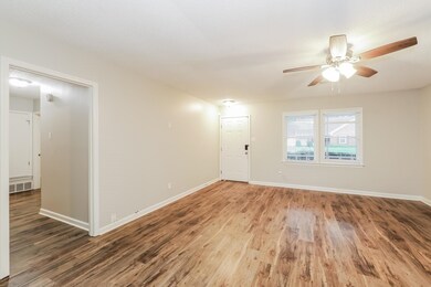 Empty room featuring hardwood / wood-style floorin