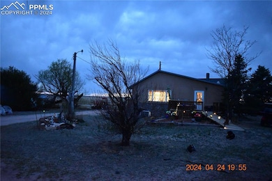 The east side of the home has a small intimate dec