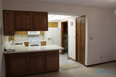 kitchen with entrance to laundry room