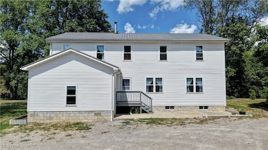 Front view of house with a metal roof.