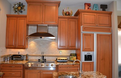 Stove & Paneled Refrigerator