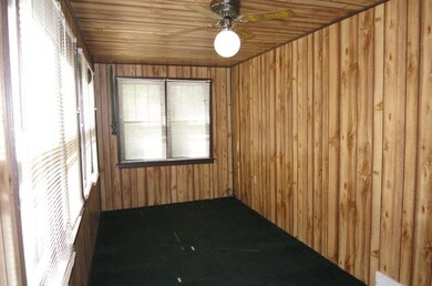 Cute front porch complete with a ceiling fan offer