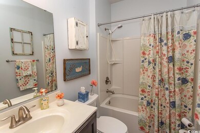 Full bathroom featuring vanity, shower / tub combo