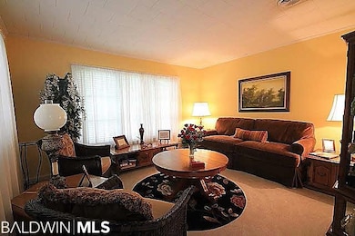 Den in the front of the house is a lovely room to sit with friends and can be converted into an office or 5th bedroom.