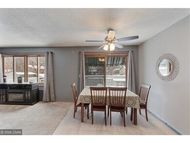 Dining with patio door to large maintenance free d