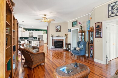 Living room looking toward kitchen and foyer