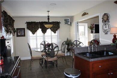Eat in kitchen area. Notice Plantation Shutters