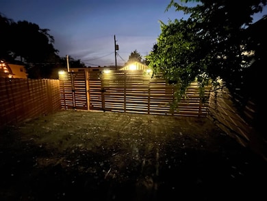 View of fenced backyard
