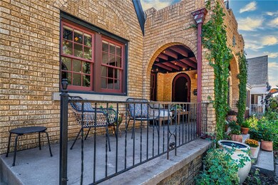 Porch with view of rounded front door.