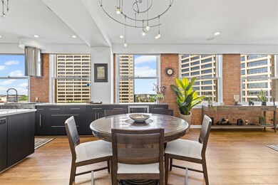 Dining area with recessed lighting, light wood-sty