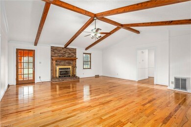 Living Room exits to Sunroom & Kitchen
