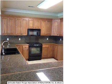 Beautiful kitchen with granite counter tops and br