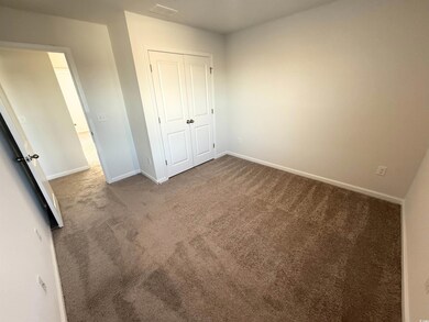 Unfurnished bedroom with carpet flooring and a clo