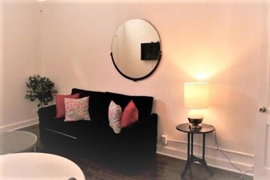 Another View Of Living Room, Provided Wall-Mounted
