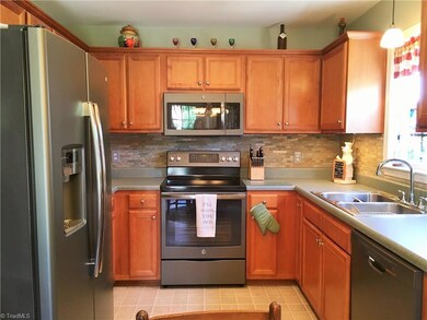 Nicely done kitchen with almost new charcoal appliances and lots of cabinets.