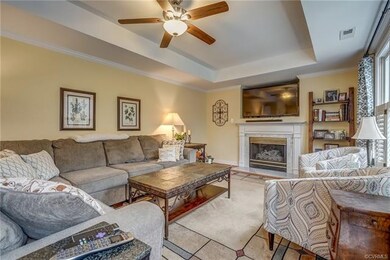 Family Room with Hardwood Floors, Crown Molding Ce
