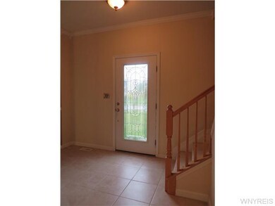 Foyer Ceramic tiled foyer with leaded glass door