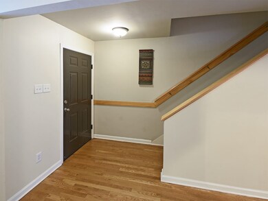 The entry/stairwell space is spacious enough for a