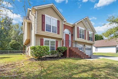 Raised ranch with a front lawn