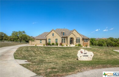 Front view with driveway.