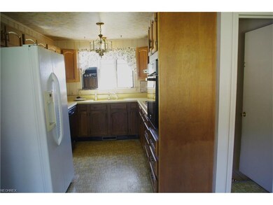 Kitchen extends out to eat in kitchen.  All applia