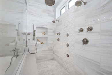 Luxurious Owners Bathroom has spa shower and doubl
