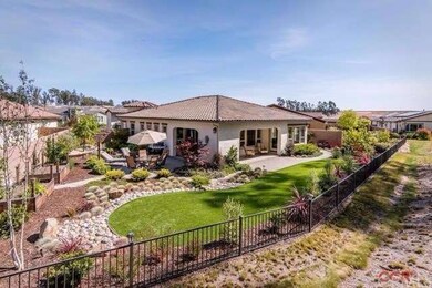 Large, fully landscaped backyard with Artificial t
