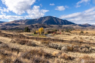 The ranch consists of four separate tax parcels with dramatic views of nearby hills, mountains and the Methow River valley.