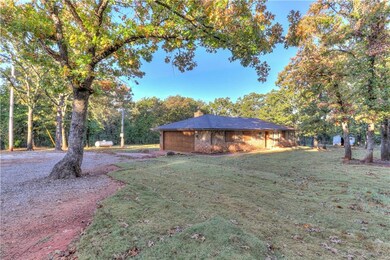Driveway view of the home on 7 acres. Keep looking