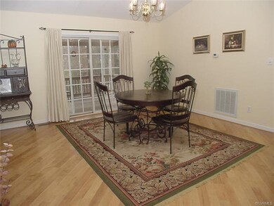 Dining area hass glass doors to the screened porch