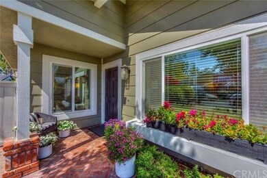 Inviting front entry with covered sitting area and