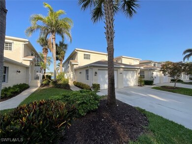 View of side of home featuring concrete driveway,