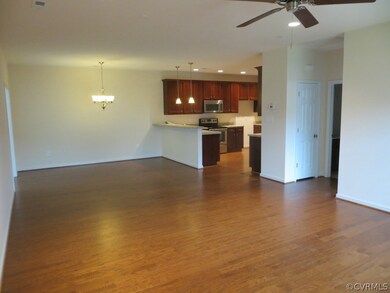 Huge living area with hardwood floors and recessed