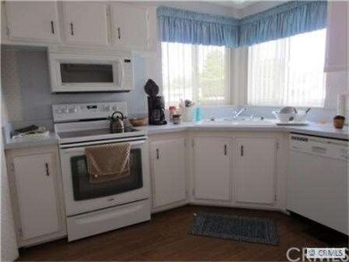 Remodeled kitchen showing glass top stove