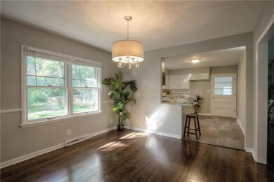 Eating area next to kitchen with refinished wood f