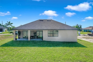 Lanai under truss w/paver floor is plumbed for an Outdoor Kitchen.