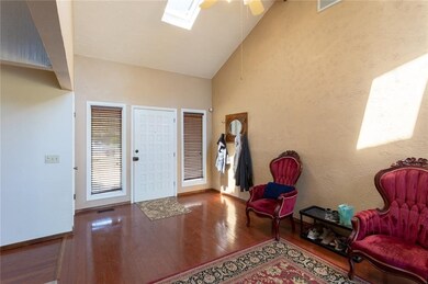 Entry way with high ceiling and skylight as well a