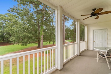 Unfurnished sunroom with ceiling fan