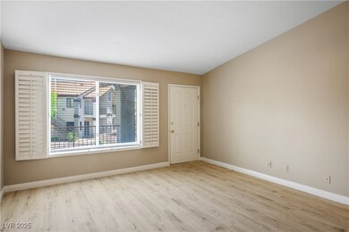 Unfurnished room with wood finished floors and bas
